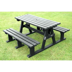 Black picnic table with attached benches, placed on green grass.